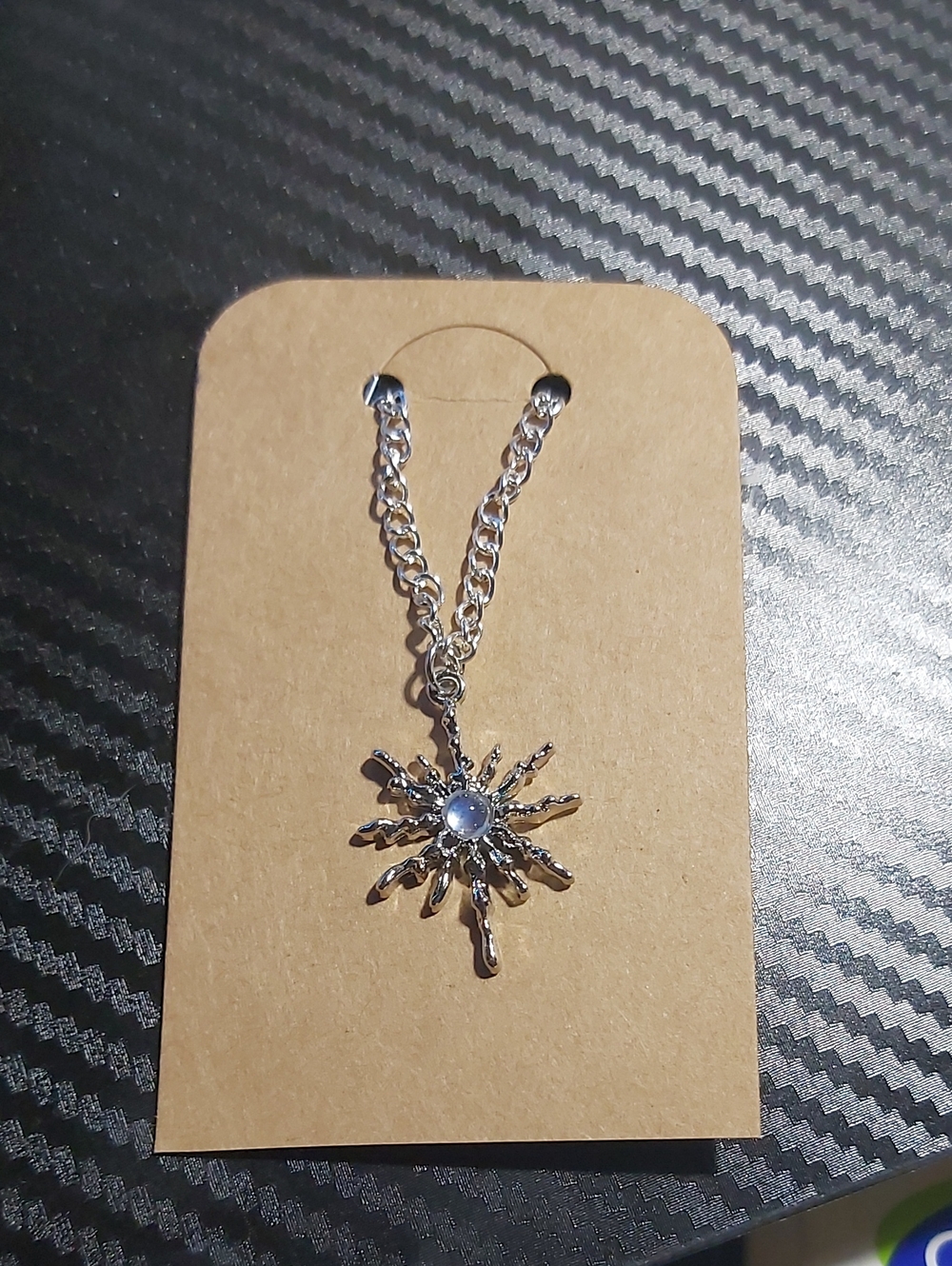 Silver Sunburst Pendant Necklace with Blue Center